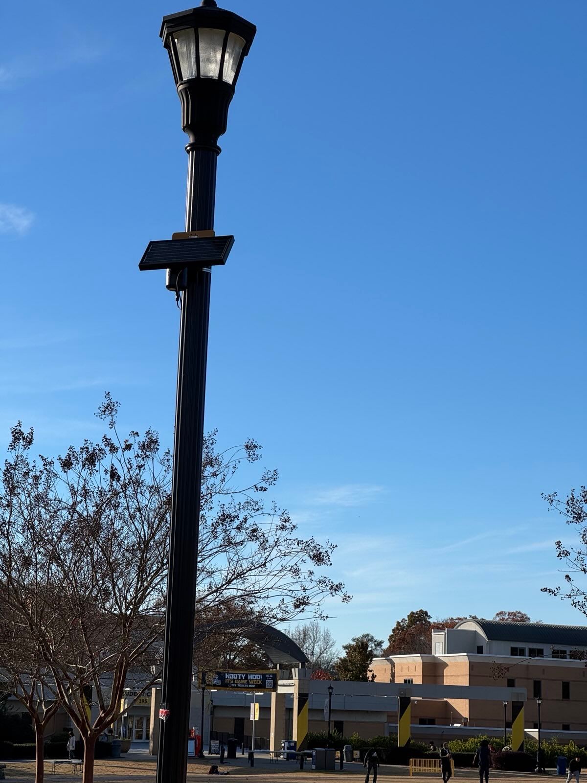 Image of a Flock Raven AI Microphone outside of the Student Center